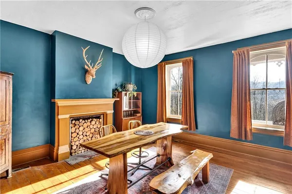 a living room with furniture a window and bookshelf
