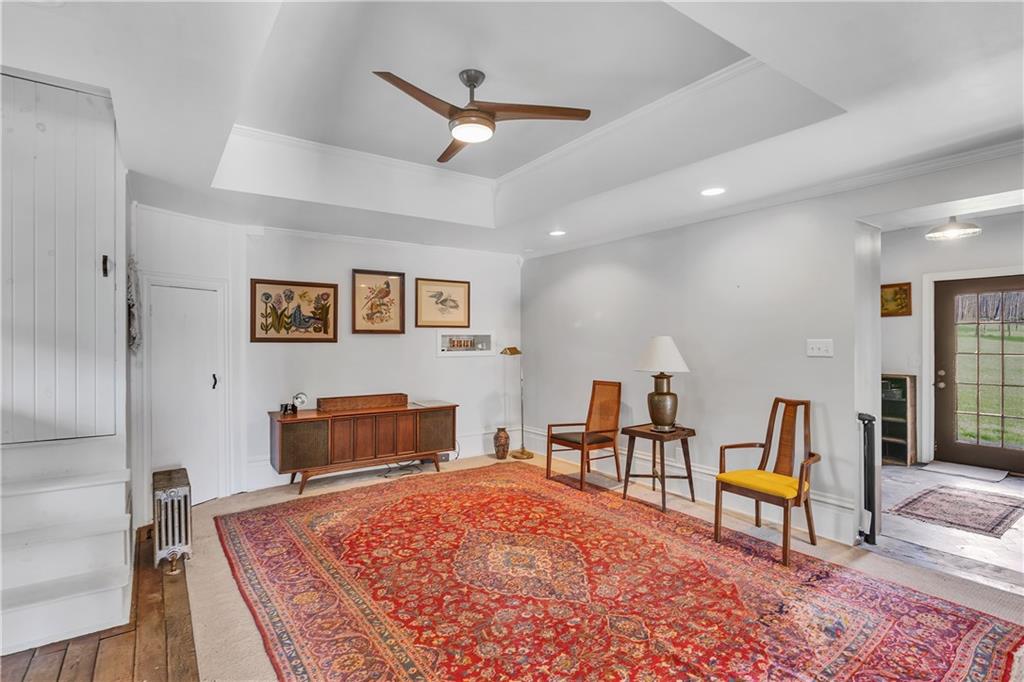 389 East Rices Landing Road East Millsboro, PA 15433 - Photo 18 of 42 The living room is open and airy with a set of servant stairs that leads up to a bedroom. This room may have once been a kitchen and the stairs were used to separate labor from formal living areas.