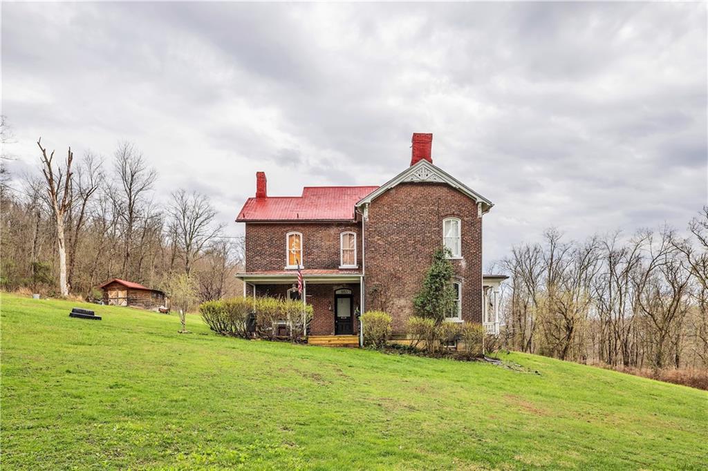 389 East Rices Landing Road East Millsboro, PA 15433 - Photo 3 of 42 Another view of the side of the farmhouse.