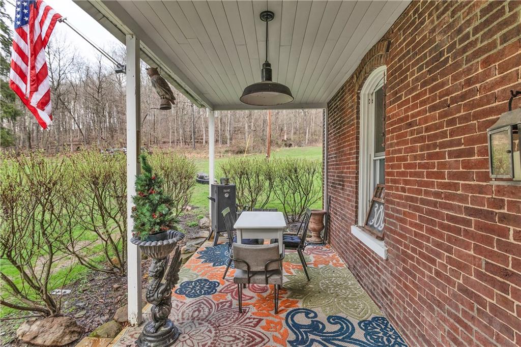 389 East Rices Landing Road East Millsboro, PA 15433 - Photo 4 of 42 Peaceful side porch to listen to birdsong whilst drinking morning coffee.