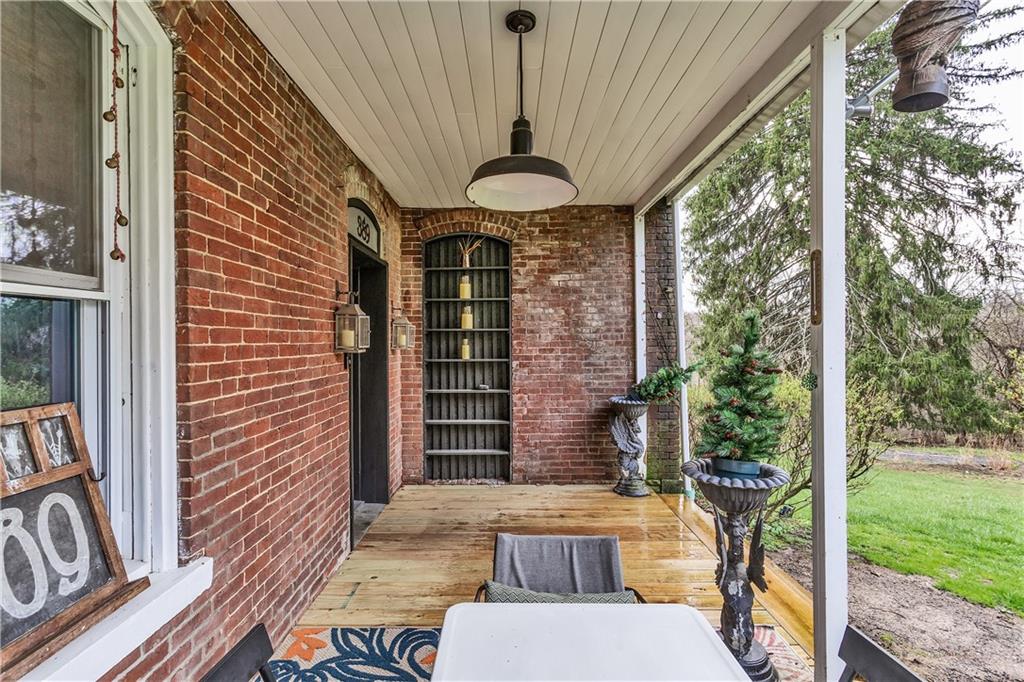 389 East Rices Landing Road East Millsboro, PA 15433 - Photo 5 of 42 Even while raining, this porch gives a comforting feeling.