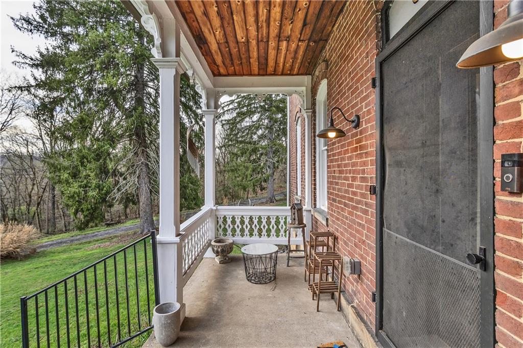 389 East Rices Landing Road East Millsboro, PA 15433 - Photo 7 of 42 Porch on front of home facing toward the river. A RARE, COUNTRY RETREAT with tranquility where you can find your peace.