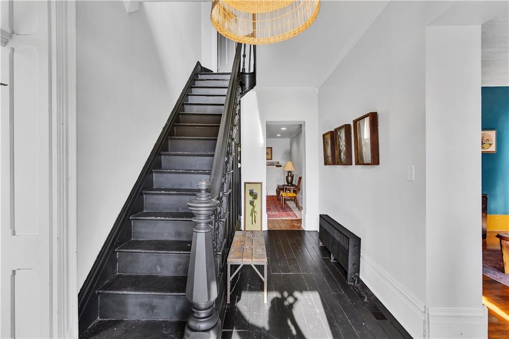 389 East Rices Landing Road East Millsboro, PA 15433 - Photo 8 of 42 Hallway and stairs where the warm glow of the sun washes the hall with warmth.