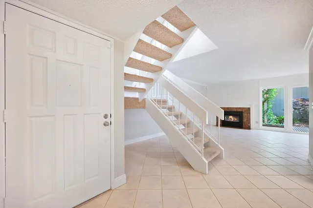 a view of an entryway with wooden floor