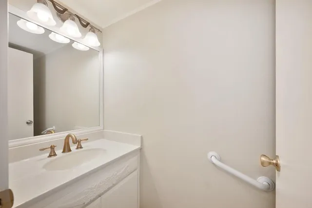 a kitchen with stainless steel appliances granite countertop a stove sink and cabinets