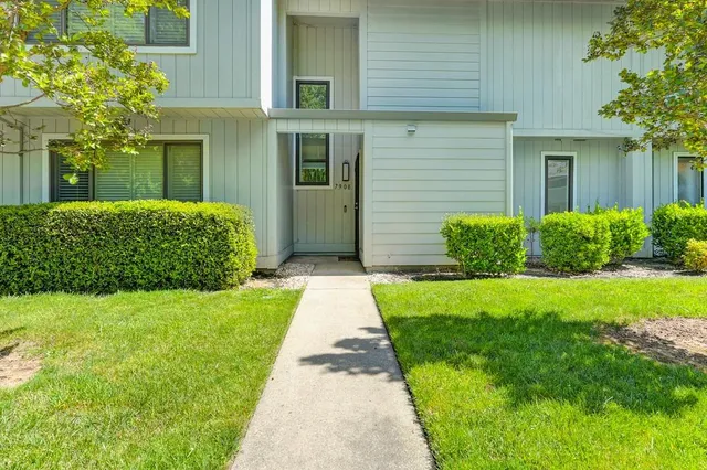 a front view of a house with a yard