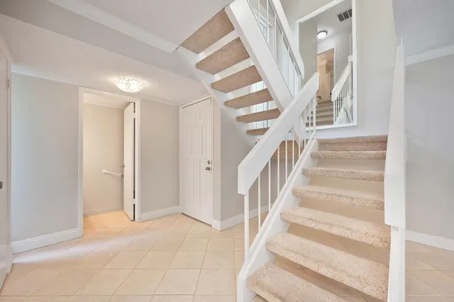 a view of a bathroom with a shower and closet