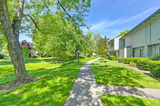 a view of a house with a yard
