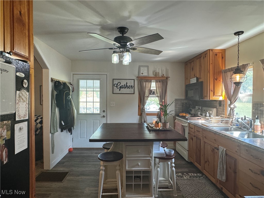1480 Jerrys Run Road Belleville, WV 26133 - Photo 19 of 48 Kitchen with plenty of natural light, a breakfast bar, pendant lighting, and ceiling fan