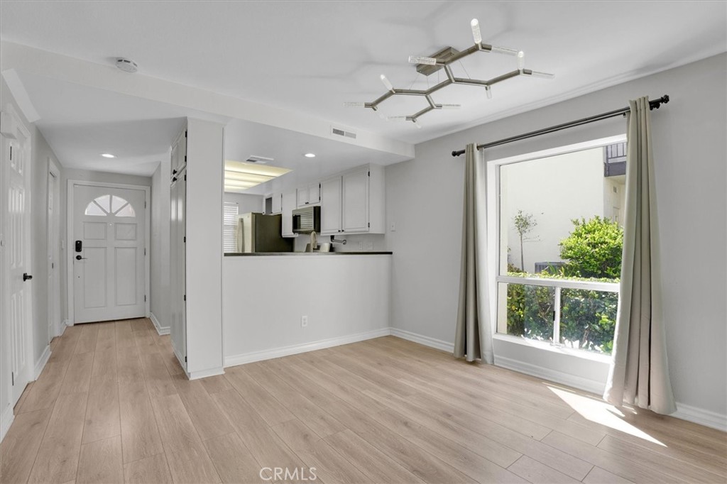 5610 Las Virgenes Road, Unit 50 Calabasas, CA 91302 - Photo 12 of 40 a view of a kitchen with wooden floor and a kitchen