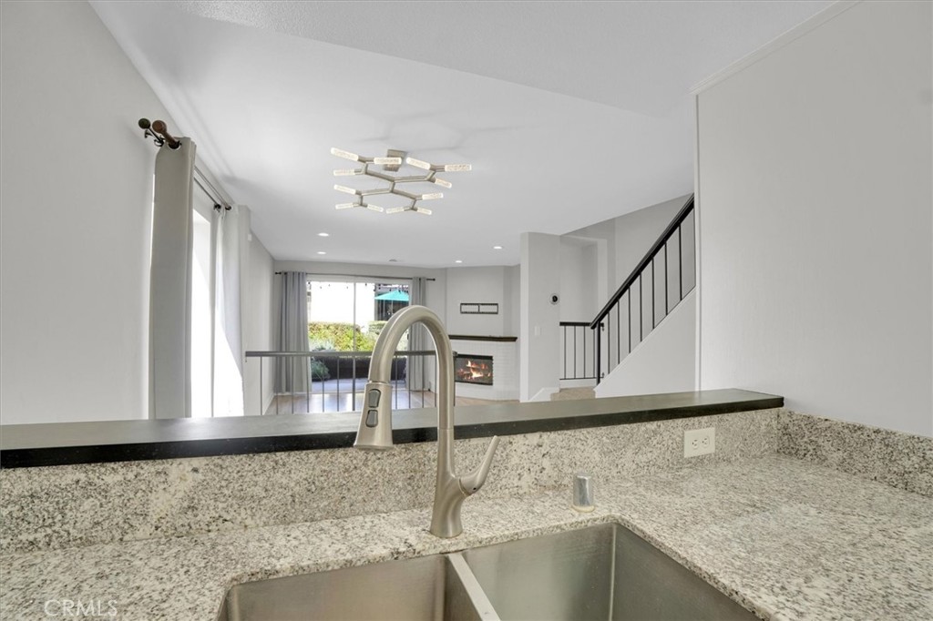 5610 Las Virgenes Road, Unit 50 Calabasas, CA 91302 - Photo 18 of 40 a view of a livingroom with wooden floor and stairs