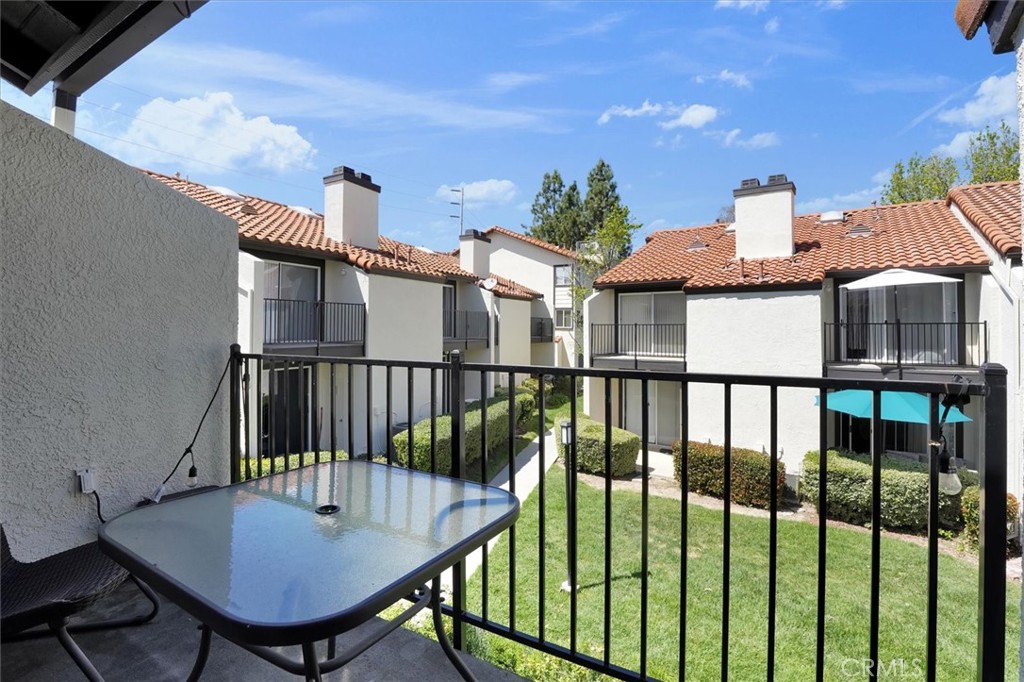 5610 Las Virgenes Road, Unit 50 Calabasas, CA 91302 - Photo 30 of 40 a view of a balcony with two chairs and a table
