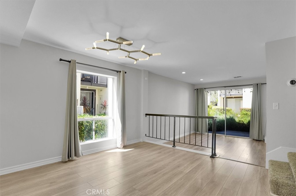 5610 Las Virgenes Road, Unit 50 Calabasas, CA 91302 - Photo 3 of 40 a view of a room with wooden floor fan and windows