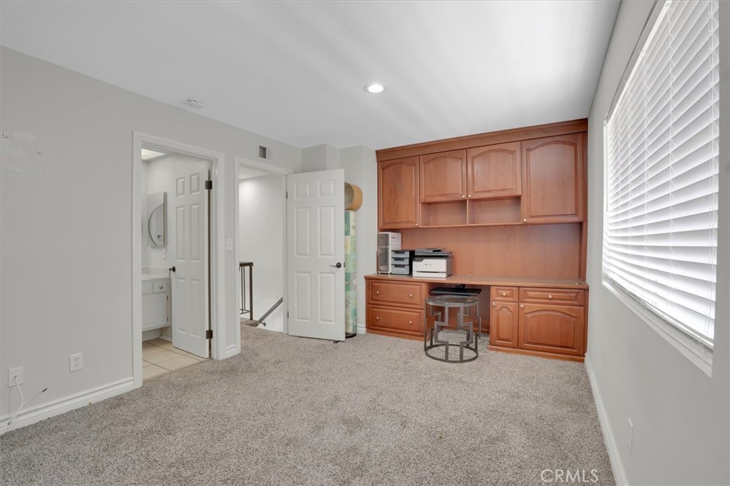 5610 Las Virgenes Road, Unit 50 Calabasas, CA 91302 - Photo 33 of 40 a room with a refrigerator and cabinets