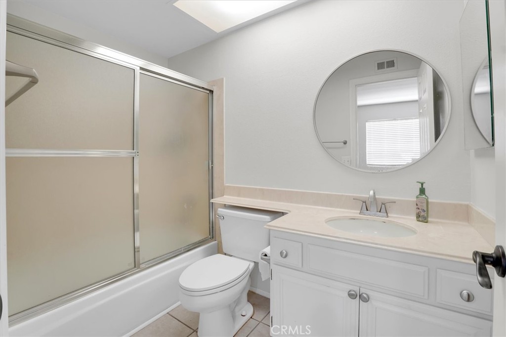 5610 Las Virgenes Road, Unit 50 Calabasas, CA 91302 - Photo 35 of 40 a bathroom with a sink a toilet and a mirror