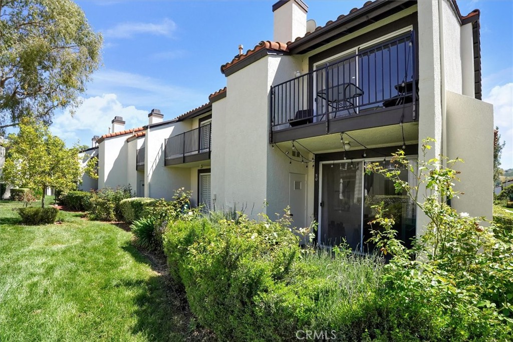 5610 Las Virgenes Road, Unit 50 Calabasas, CA 91302 - Photo 36 of 40 front view of a house with a small yard