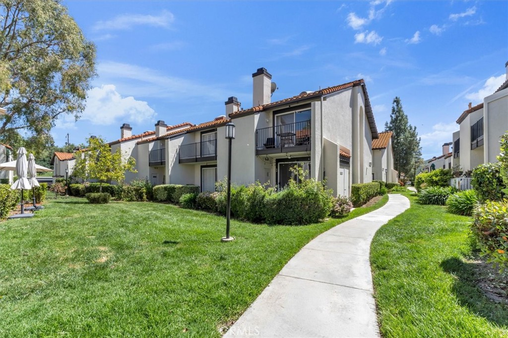 5610 Las Virgenes Road, Unit 50 Calabasas, CA 91302 - Photo 39 of 40 a front view of a house with a yard
