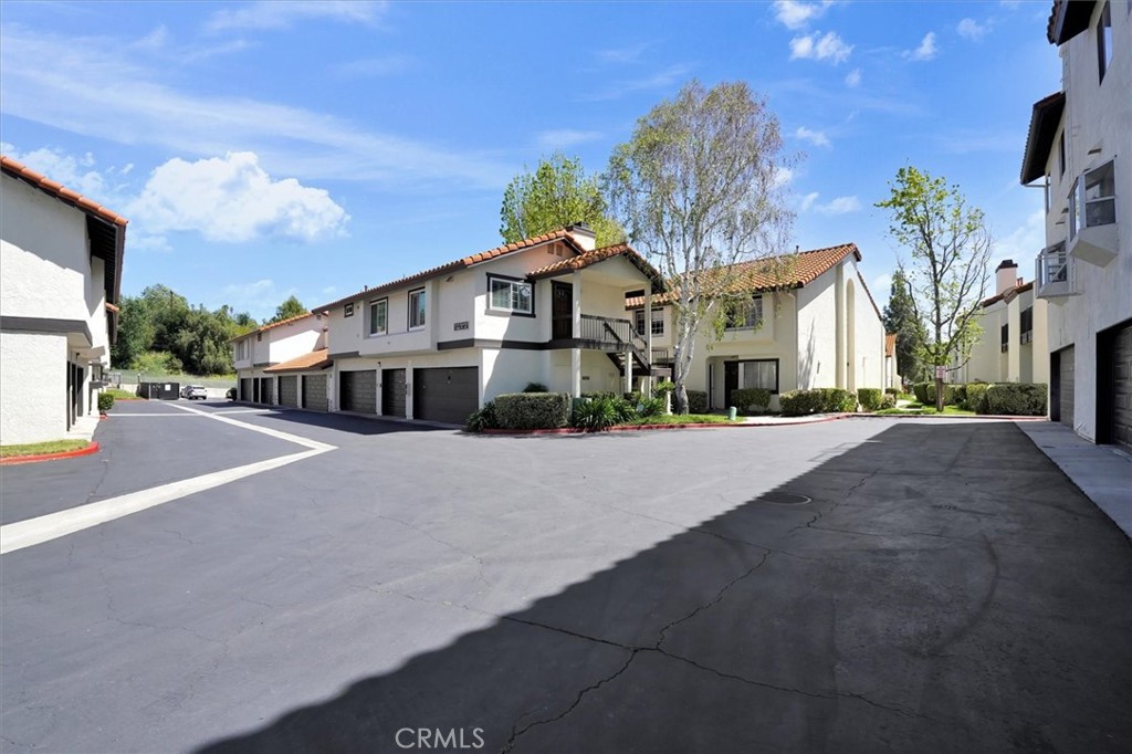 5610 Las Virgenes Road, Unit 50 Calabasas, CA 91302 - Photo 40 of 40 a view of a white house with a street
