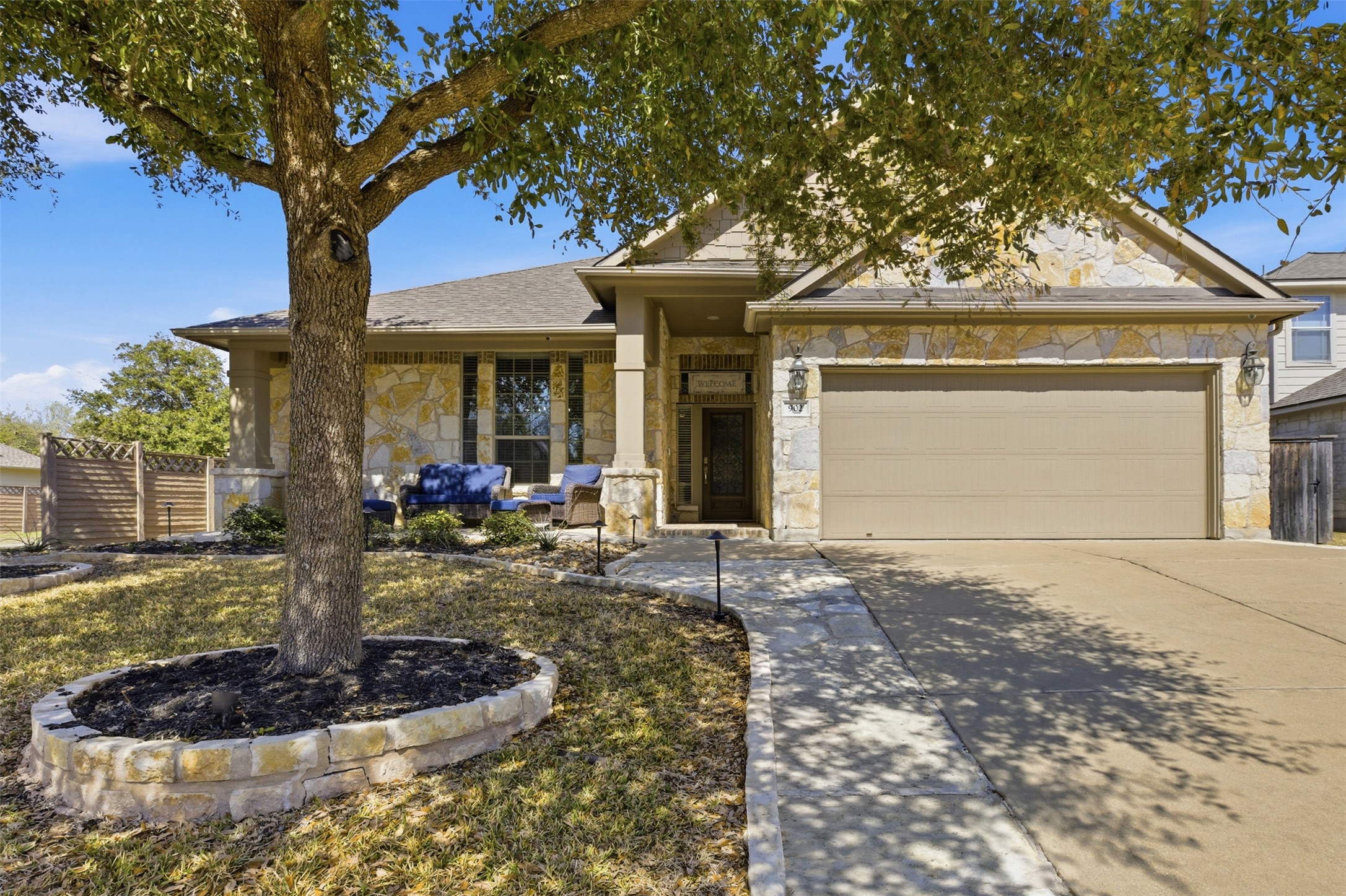902 Fork Ridge Path Round Rock, TX 78665 - Photo 1 of 1 View of front of property with stone siding, driveway, a garage, and roof with shingles