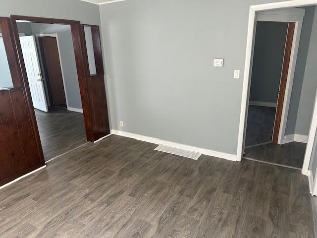 506 East 144th Place Dolton, IL 60419 - Photo 13 of 37 an empty room with wooden floor and entrance