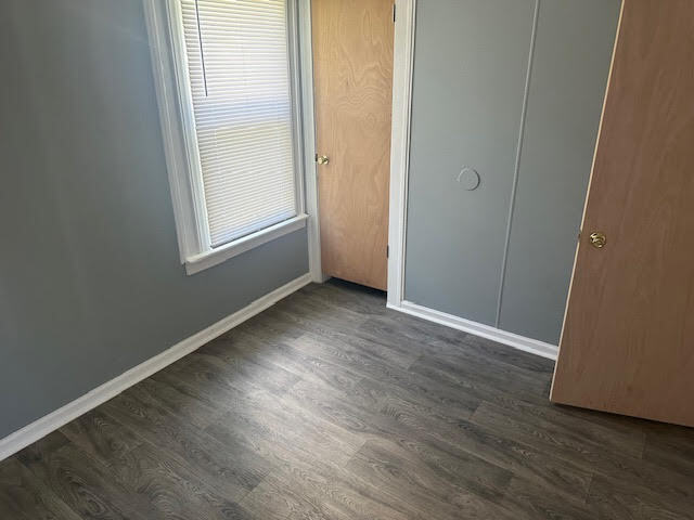 506 East 144th Place Dolton, IL 60419 - Photo 29 of 37 an empty room with wooden floor and windows
