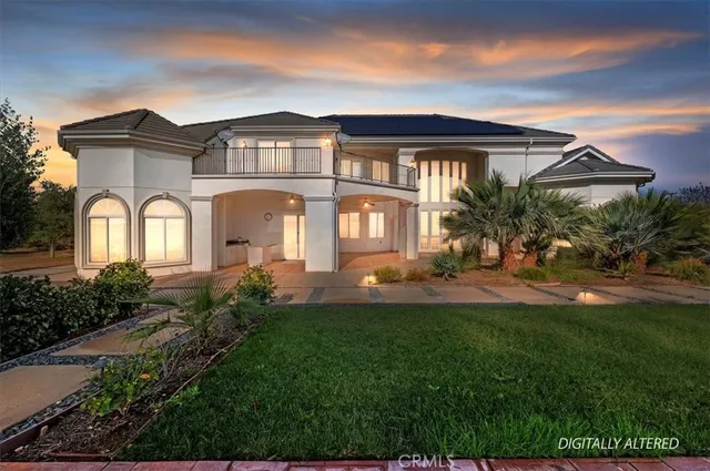 a view of a white house with a sink and a yard