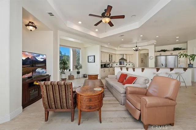 a view of living room filled with furniture and wooden floor