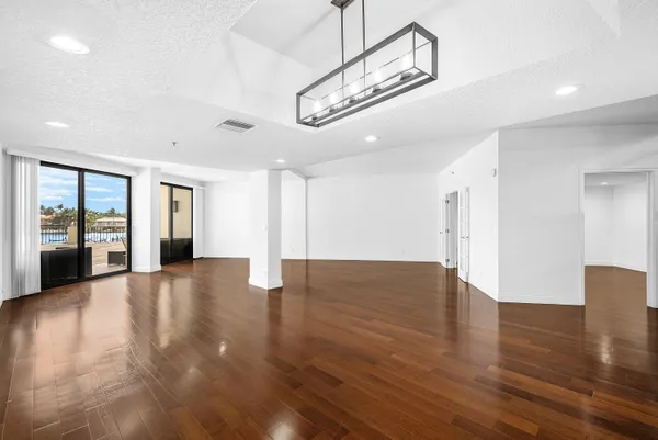 a view of an entryway with wooden floor