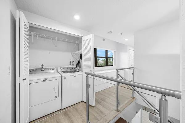 a bathroom with a granite countertop toilet a sink and bathtub