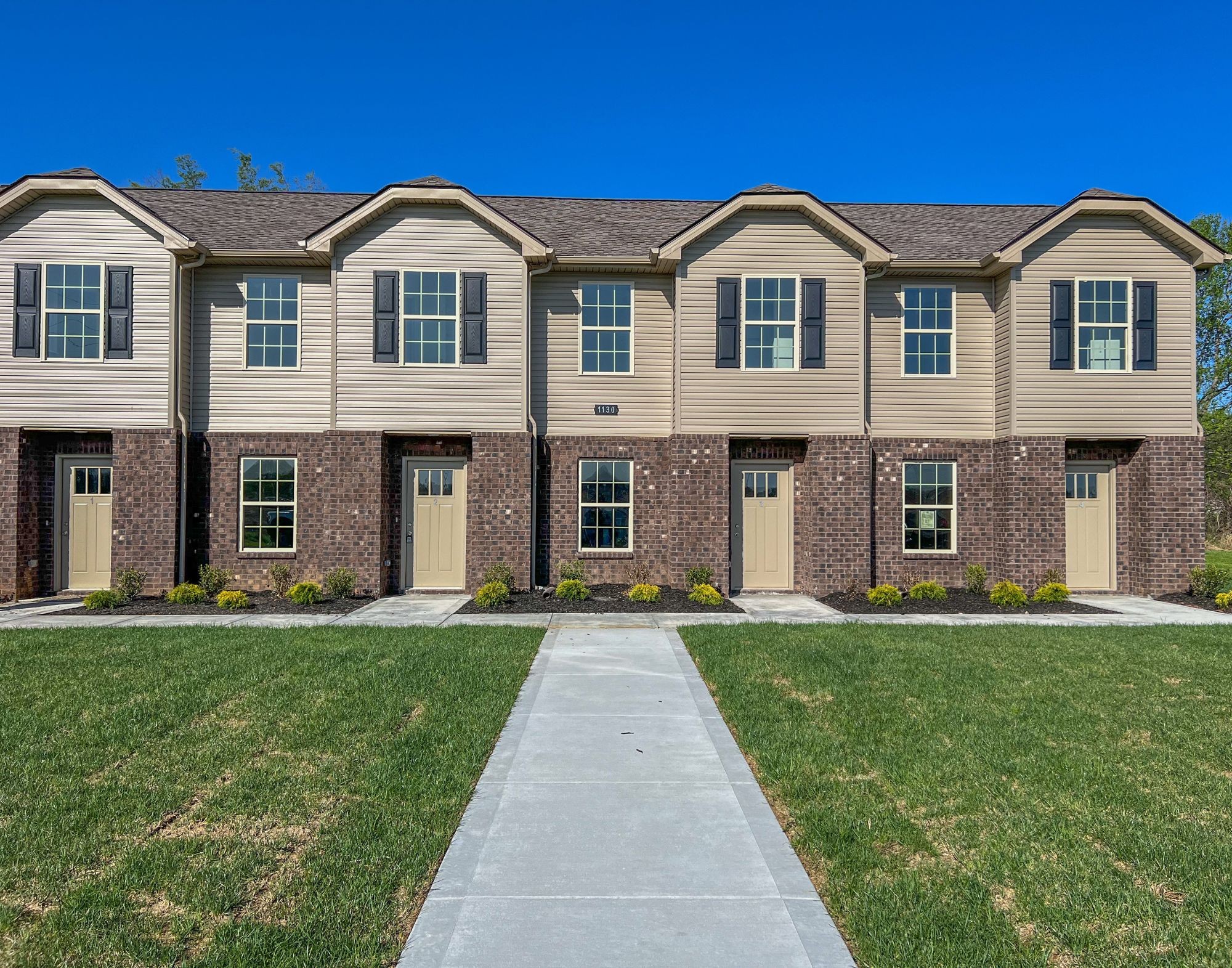 1130 Pembroke Oak Grove Road, Unit 1 Oak Grove, KY 42262 - Photo 1 of 37 front view of a brick house with a yard