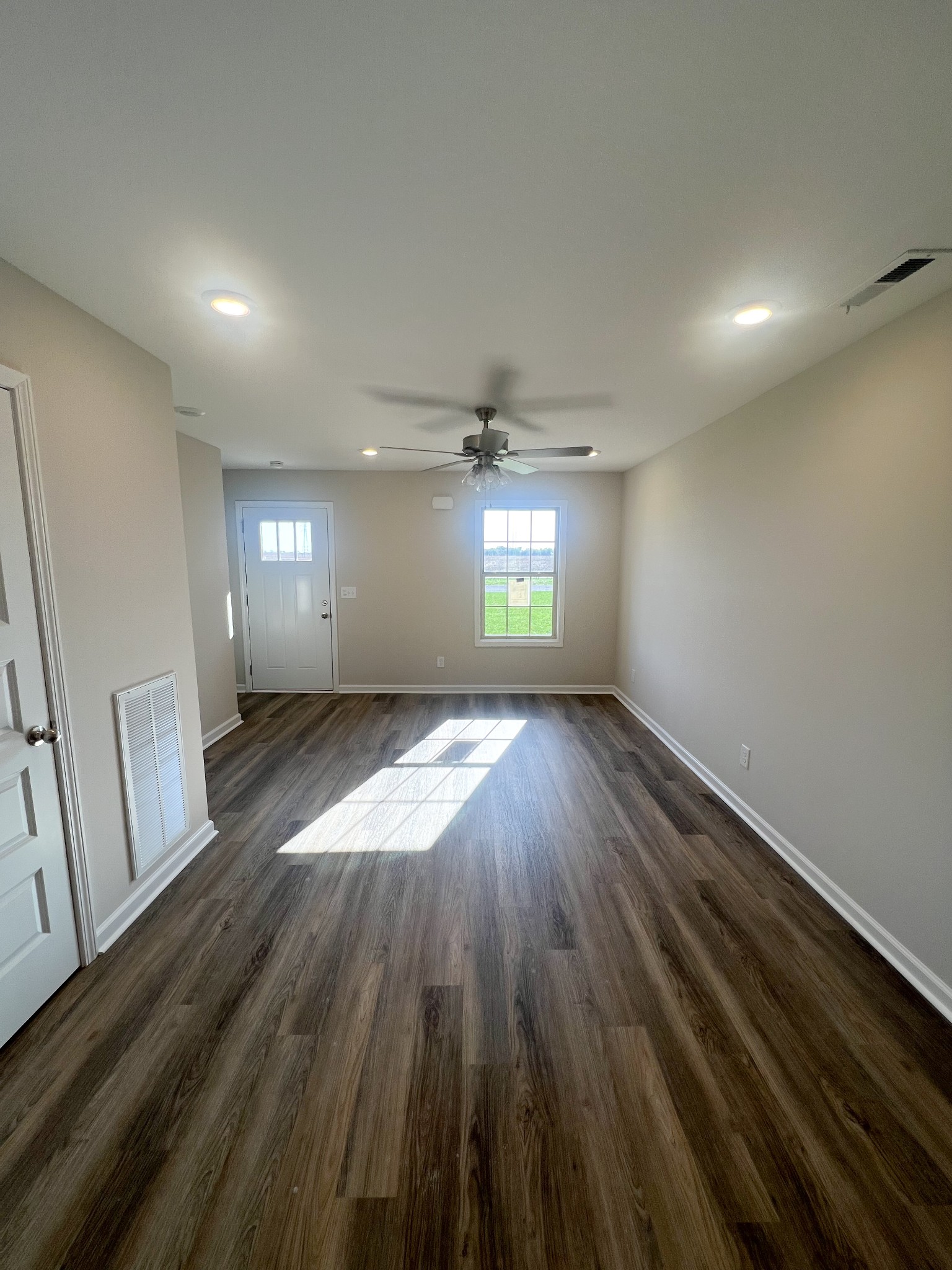 1130 Pembroke Oak Grove Road, Unit 1 Oak Grove, KY 42262 - Photo 5 of 37 an empty room with wooden floor and windows
