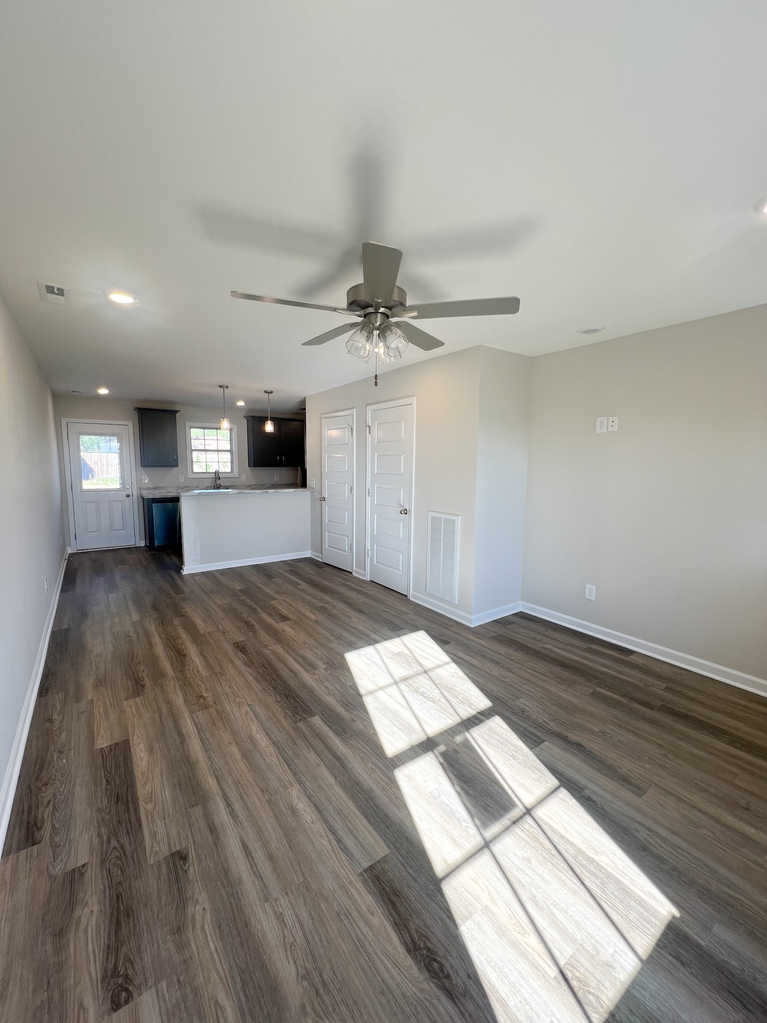 1130 Pembroke Oak Grove Road, Unit 1 Oak Grove, KY 42262 - Photo 6 of 37 a view of a room with wooden floor and a ceiling fan