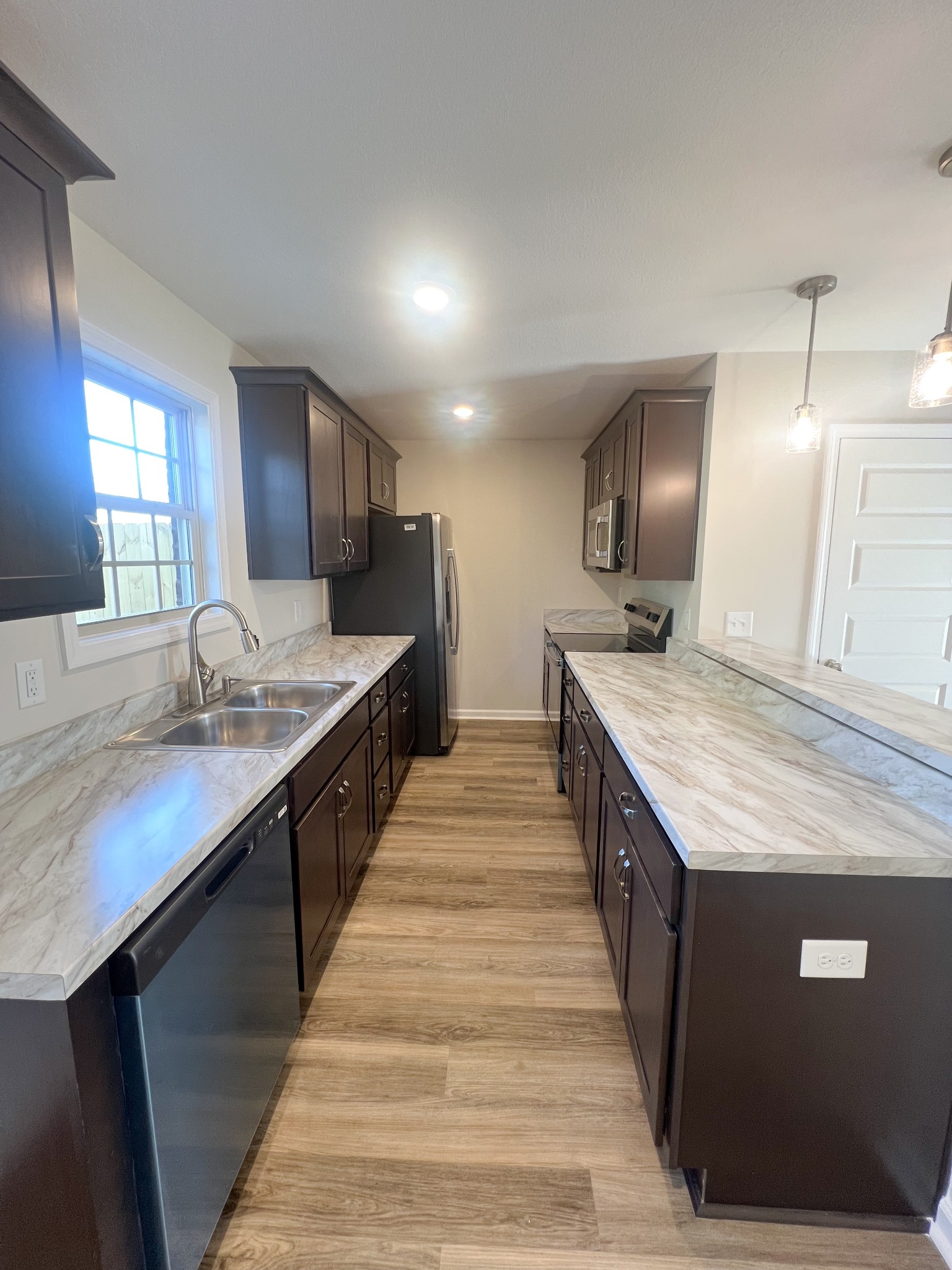 1130 Pembroke Oak Grove Road, Unit 1 Oak Grove, KY 42262 - Photo 8 of 37 a large kitchen with a center island and stainless steel appliances