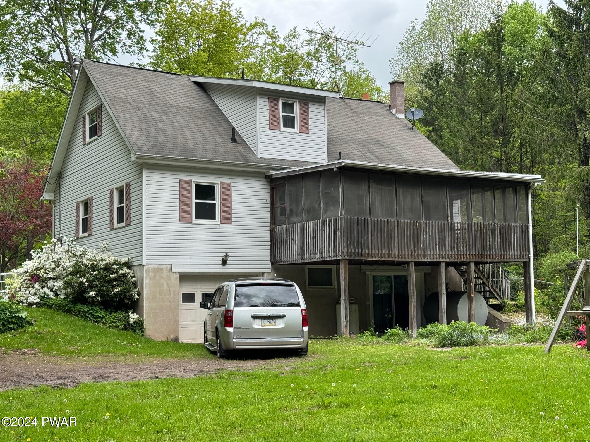 359 Canaan Road Waymart, PA 18472 - Photo 7 of 32 a house view with a garden space