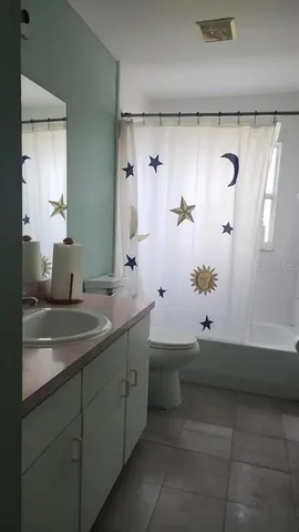 a bathroom with a sink and mirror