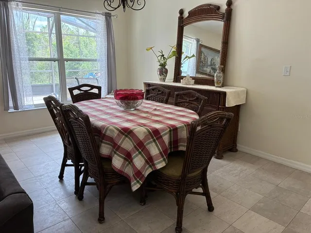 a bedroom with a bed table and window