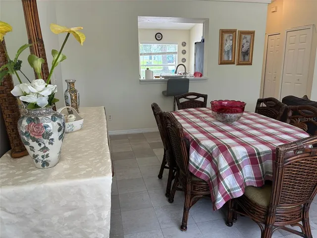 a dining room with furniture and window