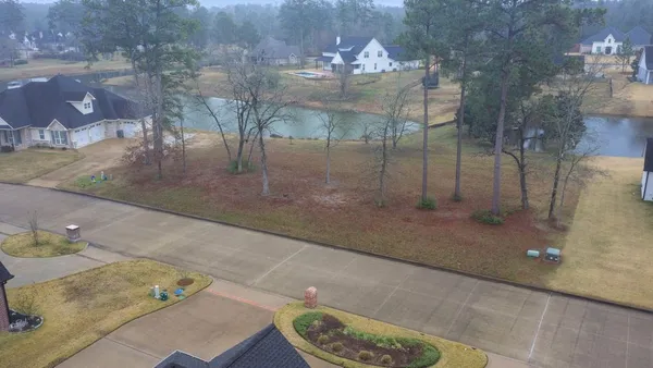 a picture of a room with furniture and wooden floor