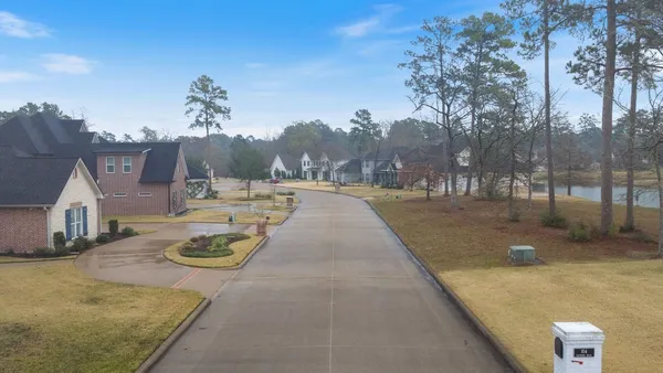 a view of a backyard with sitting area