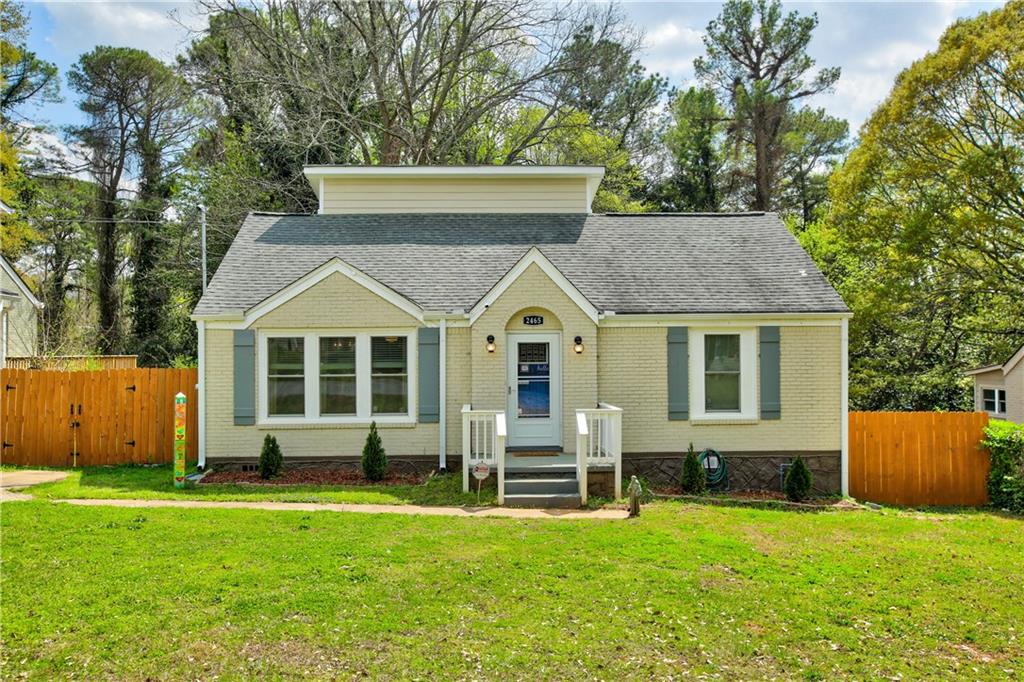 2465 Mellville Avenue Decatur, GA 30032 - Photo 1 of 1 a view of a house with a yard