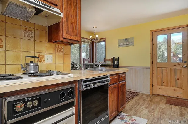 a kitchen with a stove and a sink