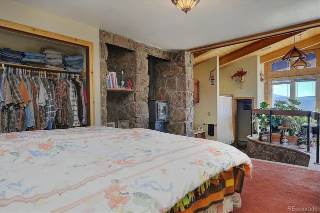 a bedroom with a bed and a mirror