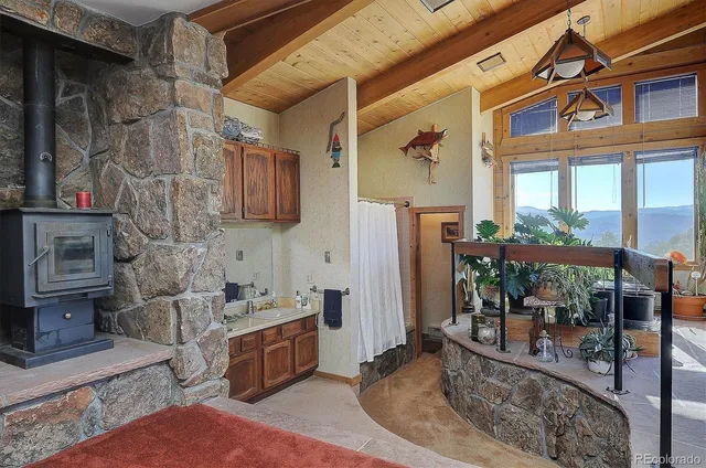 a kitchen with stainless steel appliances granite countertop a stove and cabinets