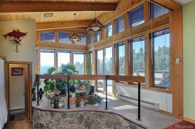 a view of a building with a porch and a potted plant
