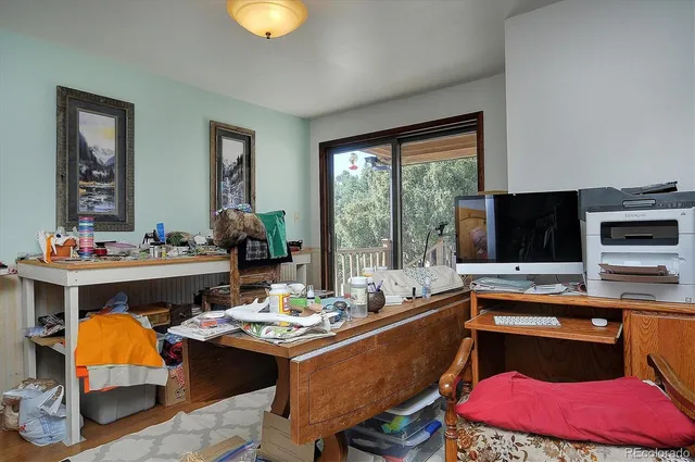 a room with furniture and flat screen tv