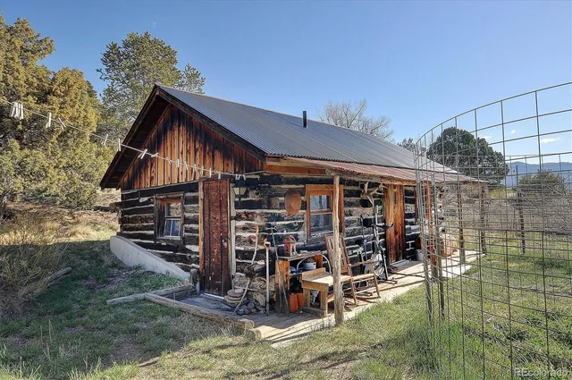 a view of a house with wooden deck