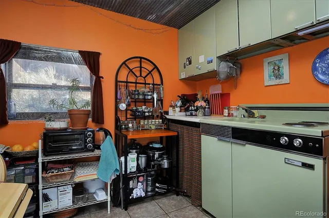 a view of a patio with a table and chairs