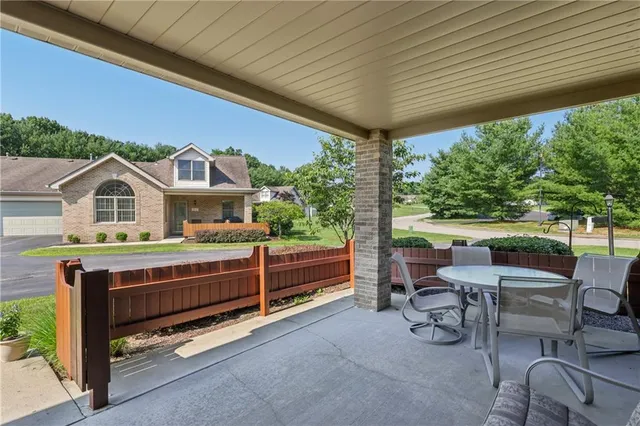 a view of a chairs and table in the patio