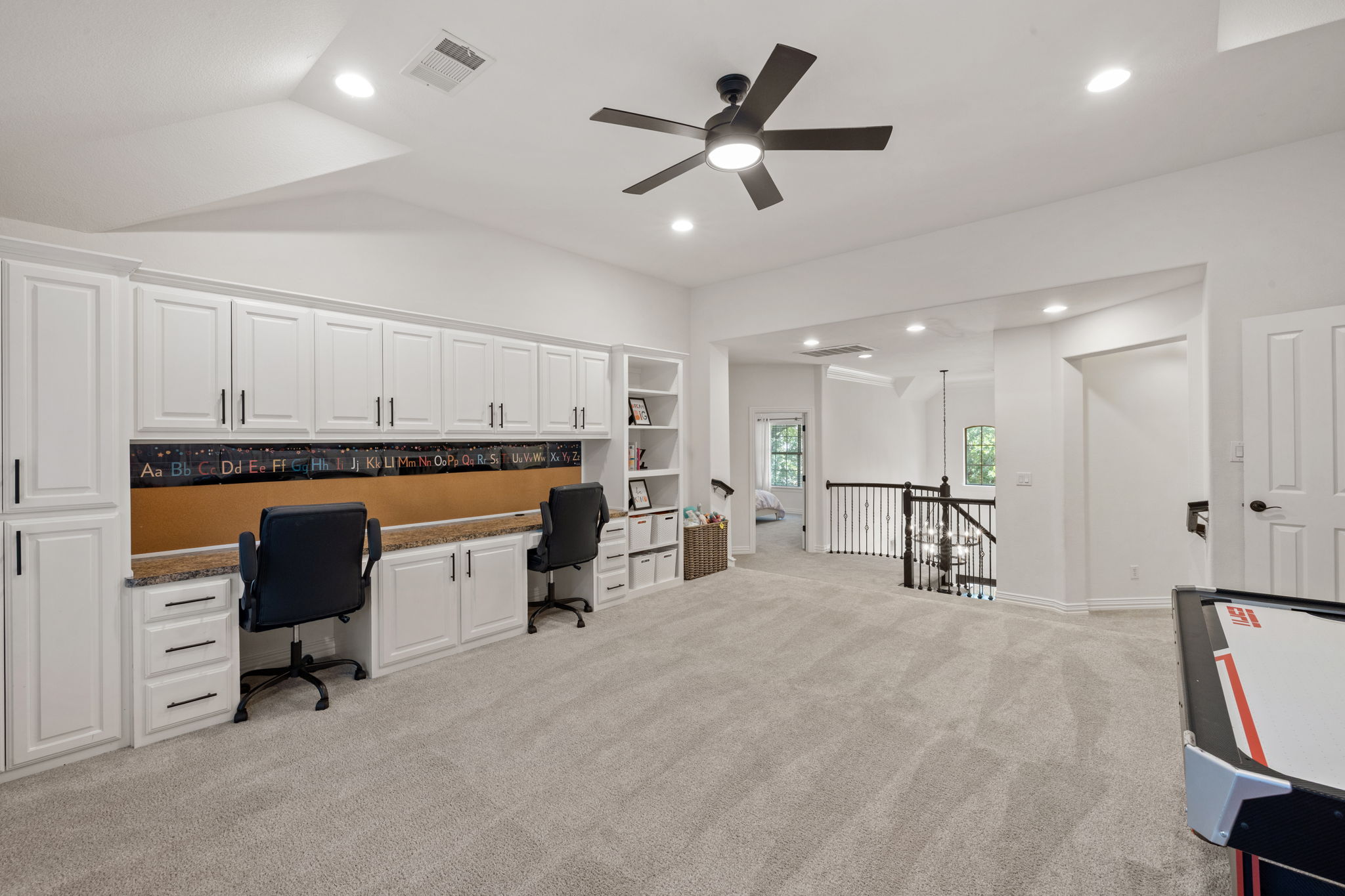 1124 Castle Path Round Rock, TX 78681 - Photo 25 of 40 Integrated desks with overhead cabinetry define a functional and organized space within this spacious upper-level area.