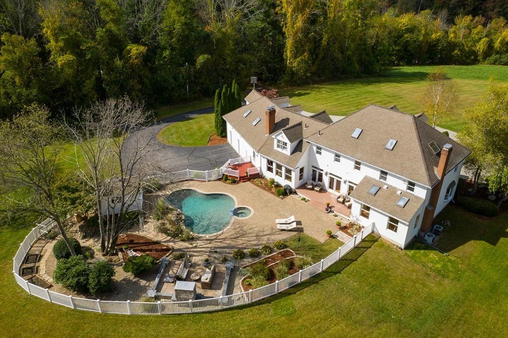 123 West Sutton Road Sutton, MA 01590 - Photo 6 of 42 a view of a swimming pool in the middle of the green field